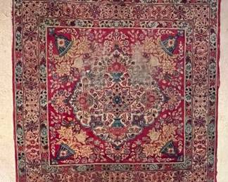 Antique Persian Rug In A Red Ground With Floral And Cornucopia Motifs