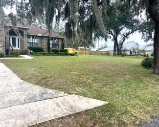 Large front yard with an entrance and an exit. Staff will assist with parking 