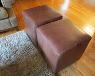 Precedent leather rolling seating ottomans