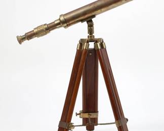 A Continental brass telescope on telescopic folding stand