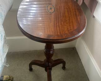 Accent table with hand-layer veneer. 