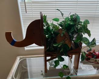 Wooden elephant needs medical attention with his trunk