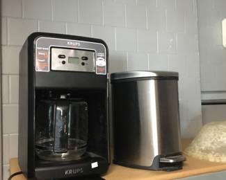 Krups coffee maker and small trash can