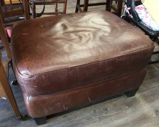 Comfy ottoman. Put on a big tray and use as a coffee table!