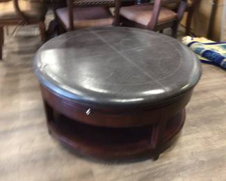 Circular ottoman with drawers on casters. Pretty cool!