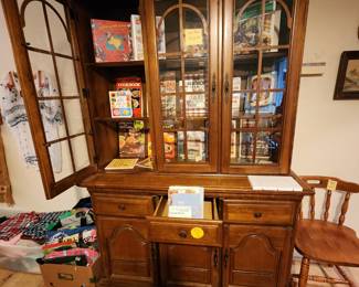 Beautiful 3 door china cabinet filled with cookbooks