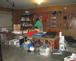still sorting in garage, garden supplies tools, shopvac etc.