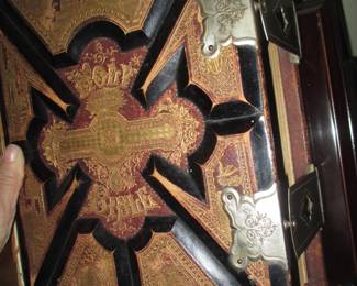 front cover with metal banding, has torn from spine