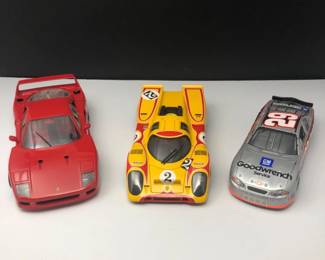 Three Die Cast Cars Ferrari, Porsche, Nascar
