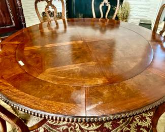 THIS ROUND TABLE COMES IN 2 SIZES.  60" AND 80"  THE OUTER LEAVES SLIDE OFF TO ENLARGE.  8 CHAIRS!  GREAT FOR A BREAKFAST ROOM OR DINING ROOM!
