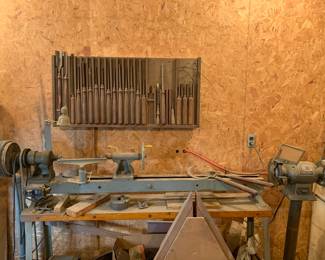 Large Wood Lathe. Comes with tools on wall. 