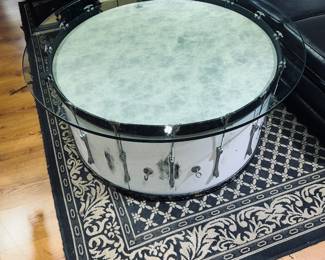 For   the Musician, this very nice Drum Cocktail/Coffee table is unique in style with an artistic flare for the unusual gift.  Extra thick glass top is a safe guard for spills and wear & tear of daily use.  Very nice!