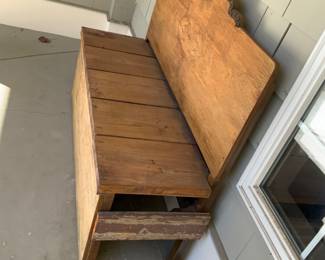 Side view of the all purpose Bench. Hand made and is beautiful. Here we have secured a place on the porch of the Store Warehouse sale.