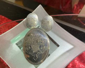 Gorgeous silver necklace with matching earrings, zoom in to see detail.  Check this item out at the many display cases full of holiday shopping ideas.