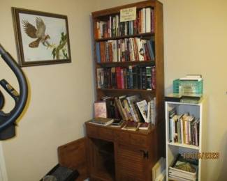 Book case.  Religios and motivalational books.  Bibles.