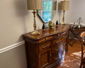 Sideboard with lamps, mirror, and dew drop displays