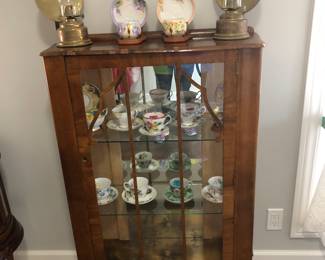 Small curio cabinet.
Tea cups
Oil Lamps