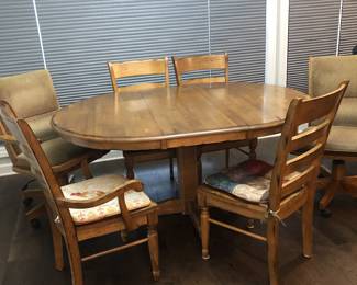4 chair dining table.
The two rolling chairs are not part of the set but can be purchased separately.