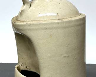 Old stoneware chicken waterier