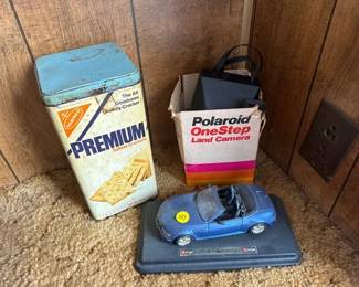 polaroid camera vintage metal cracker tin