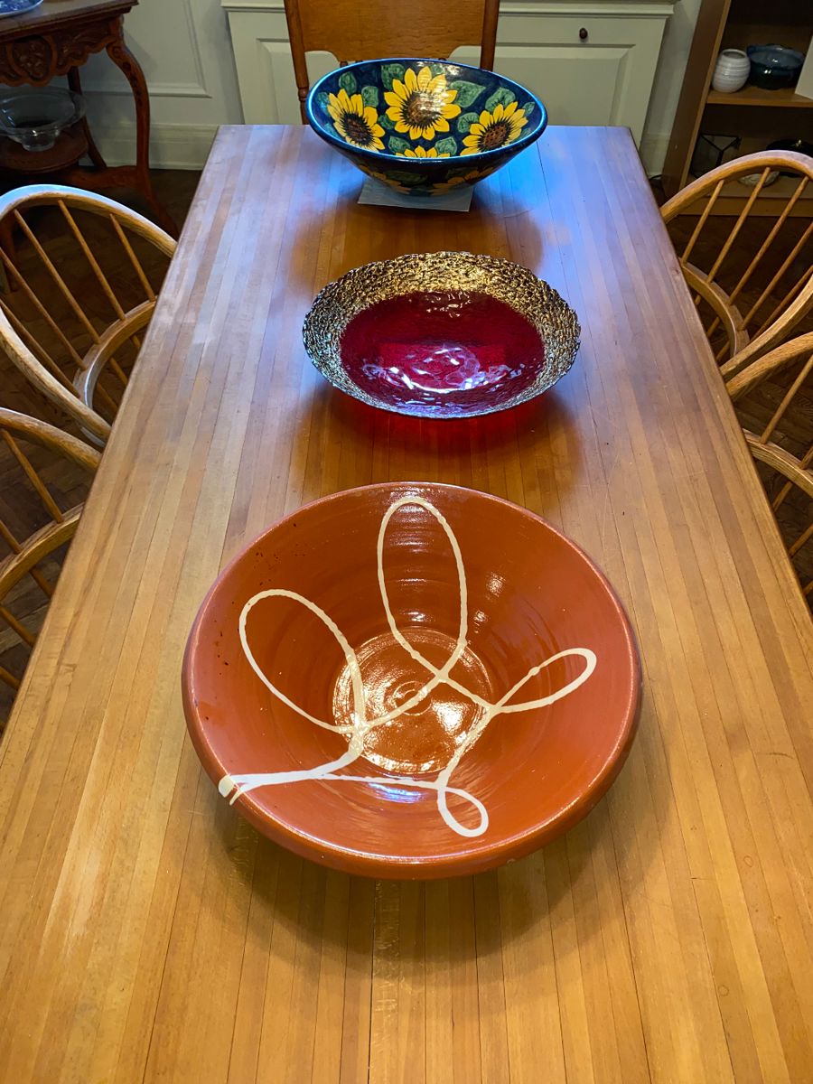Table top detail with assorted decorative-artistic platters/bowls
