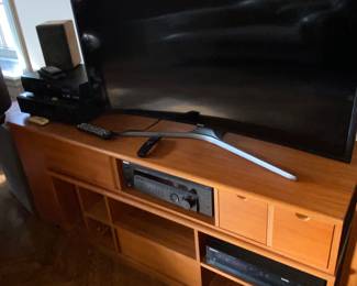 Curved screen TV and multi drawer stand cabinet 