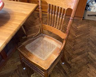 2 matching antique woven reed bottom chairs