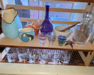 Various decorative art pieces and barware