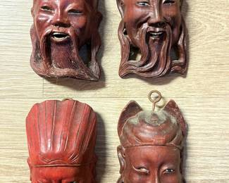 Collection of Chinese carved wood head figures.