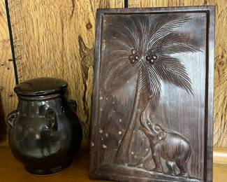Large selection of vintage carved wood art and pottery.