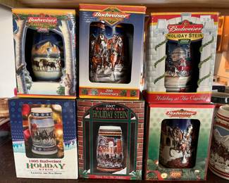 Collection of Budweiser steins in original boxes.