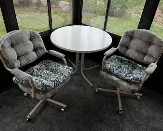 Patio table; matching patio chairs.