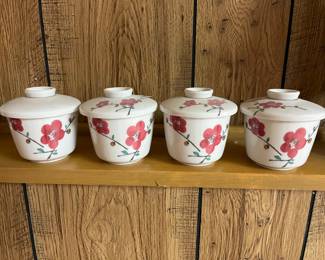 Vintage lidded bowls with dogwood flower design.