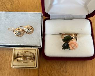 Two 14k gold rings and a pair of 14k earrings.