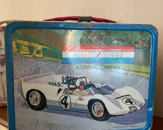 Vintage lunch box with thermos and toy