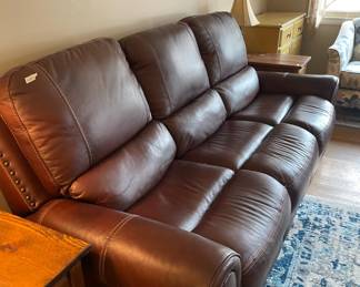 #66 3 seat leather couch with reclining seats 90x36 $ 200.00