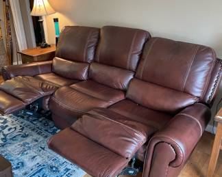 #66 3 seat leather couch with reclining seats 90x36 $ 200.00