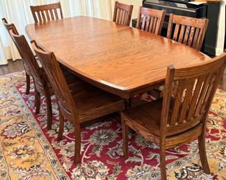 orgeous Simply Amish Dining Room Table and Eight Chairs. A solid, heavy, quality crafted table in a beautiful design. Serve all your meals in style with this lovely dining set! 

Measures 42" x 72" with two 12" leaves inserted. 