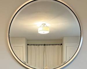 Large Circular Wall Mirror measures 42 inches in diameter