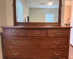 Beautiful Vintage Dresser with Mirror. The dresser measures 49 x 21.5 x 37 inches and the mirror measures 37 x 47 inches. There is some light vintage wear. 