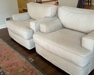 Pair of Quatrine Furniture Linen Arm Chairs. Very comfortable chairs in a nice neutral color. They match the sofa in lot 4 and are in very good condition with some light wear to the edges where there are loose threads which could be trimmed. 

The slip cover is removable/washable and replacements can be ordered from Quatrine

Each measures 41" x 43" x 32.5" 