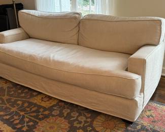 Luxurious Quatrine Furniture Linen Sofa. A truly luxurious comfortable sofa in a fabulous neutral color to match any home decor! Due to the lighting, it was difficult to photograph. It is a very lovely sofa.

The slip cover is removable/washable and replacements can be ordered from Quatrine

Some light fraying/loose threads around the edges/corners likely caused by cat scratches. The loose threads an easily be trimmed. 

Measures 83" l x 40" deep.