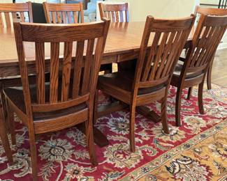 orgeous Simply Amish Dining Room Table and Eight Chairs. A solid, heavy, quality crafted table in a beautiful design. Serve all your meals in style with this lovely dining set! 

Measures 42" x 72" with two 12" leaves inserted. 