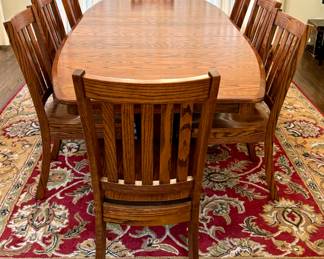 orgeous Simply Amish Dining Room Table and Eight Chairs. A solid, heavy, quality crafted table in a beautiful design. Serve all your meals in style with this lovely dining set! 

Measures 42" x 72" with two 12" leaves inserted. 