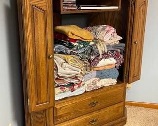 Cabinet full of quilts and blankets 