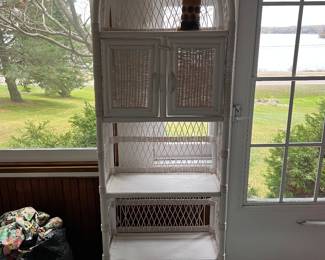 White wicker shelf unit.