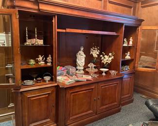 media unit with bookcases on each side with glass doors and lower cabinet