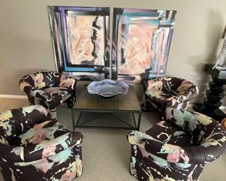 4 club chairs, a square slate and iron cocktail table and a diptych artwork 