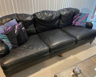 Isenhour 3 cushion couch in Grade A leather with down cushions - has casters on front and in excellent condition 