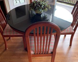 Black granite table with 5 chairs